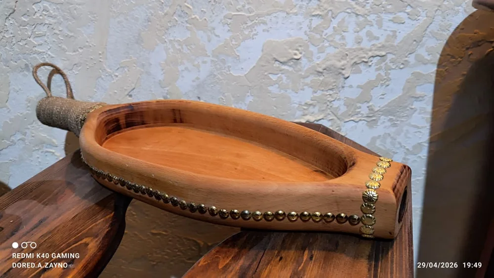 Handmade wooden tray with carved handle and brass details